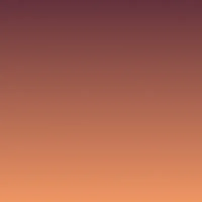 A coastline at sunset with warm orange light